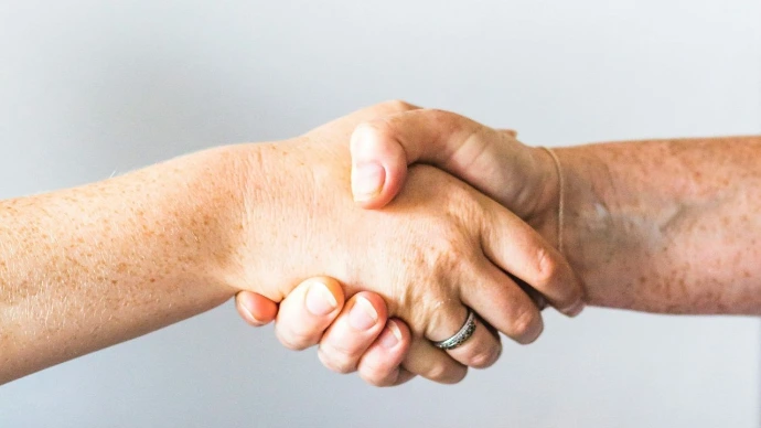person holding hands of another person